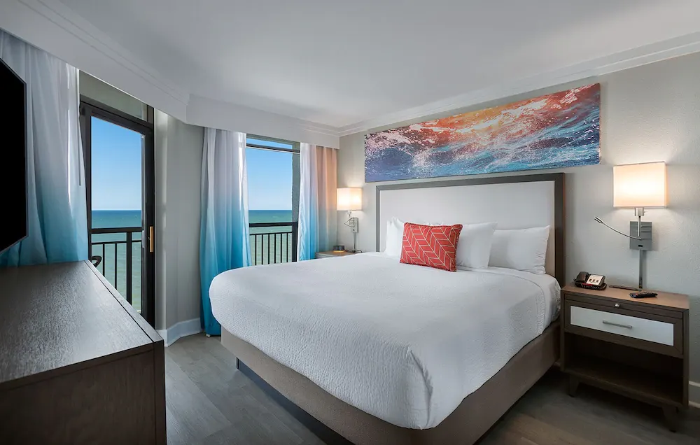 Grande Cayman Resort and its pool deck on the oceanfront